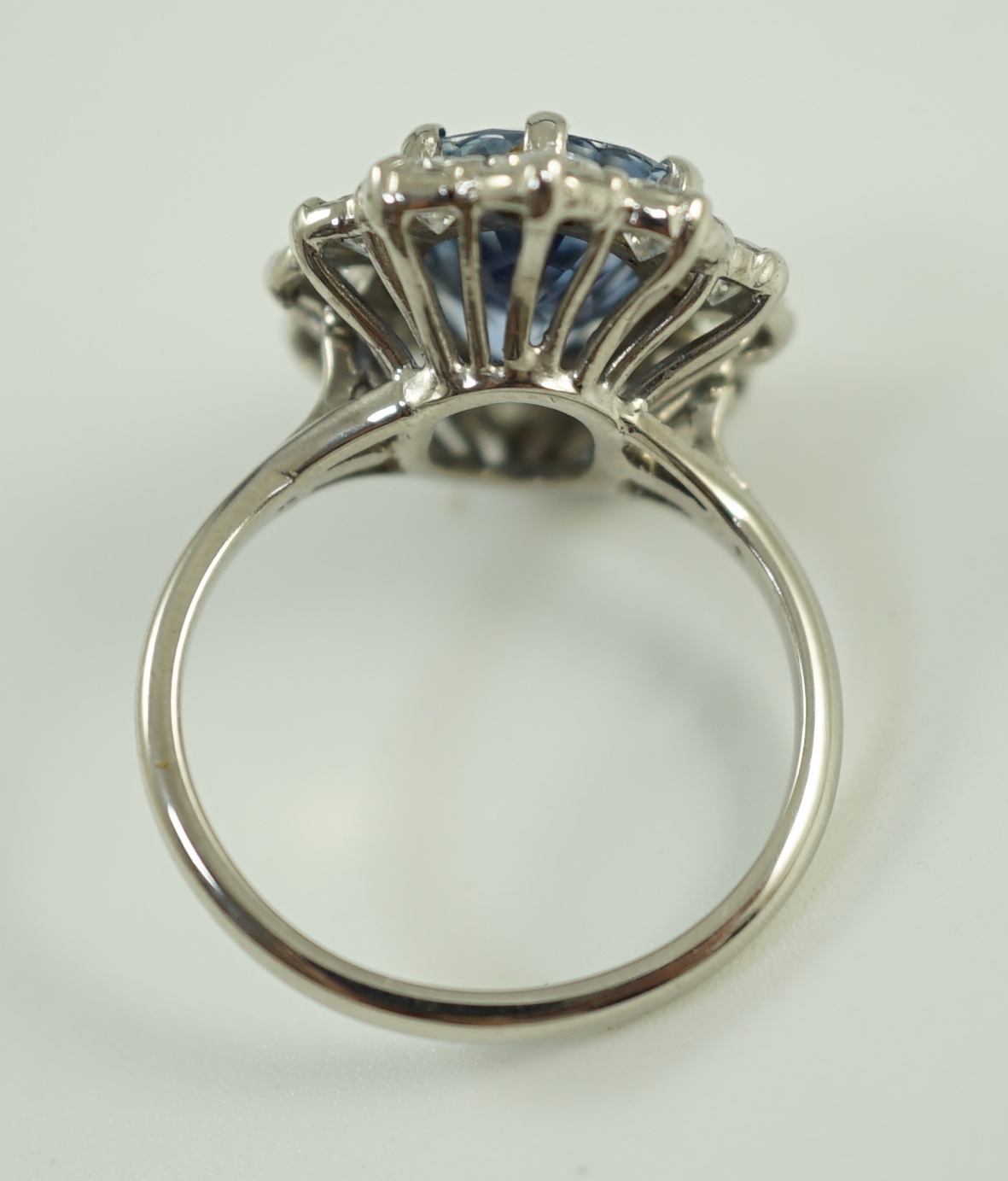 An 18ct white gold and platinum, aquamarine and diamond set oval cluster dress ring